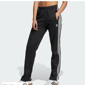 Women’s Adidas Black Beckenbauer Track Pants with white stripes down the side